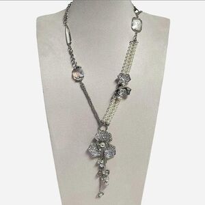 Silver-toned necklace with rhinestones flowers, faux pearls,‎ and glass bead